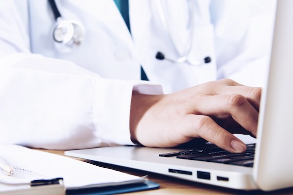 Physician using laptop